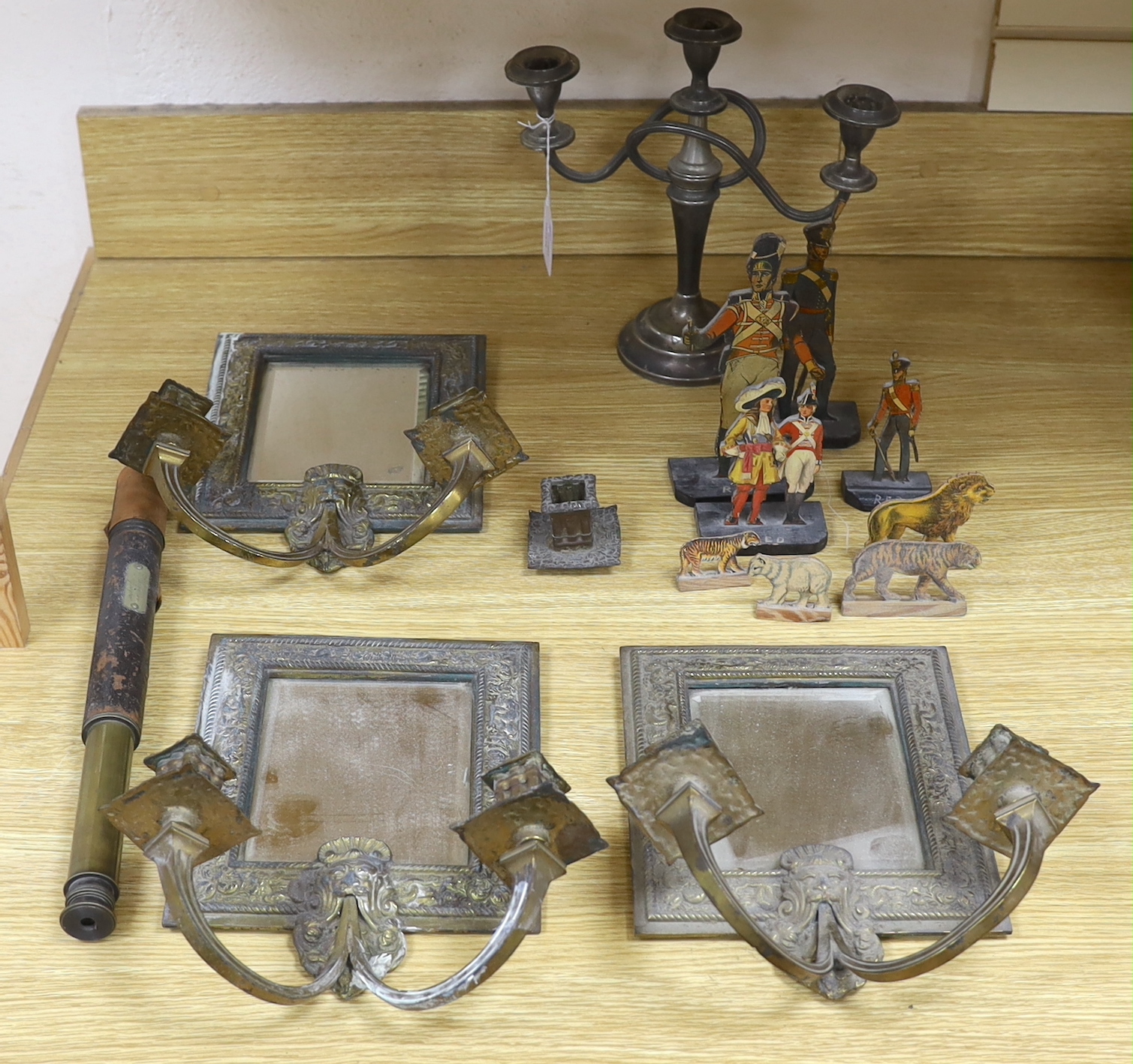 A set of three Victorian mirrored candle sconces together with various other items including a telescope